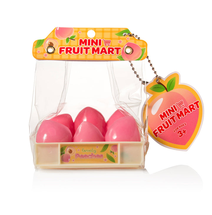 Mini Fruit Mart packaging with pink fruit-shaped items and a peach-shaped keychain on a white background.