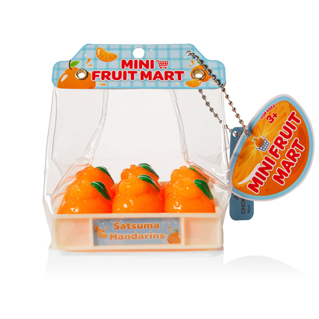 Packaged toy satsuma mandarins from Mini Fruit Mart on a white background