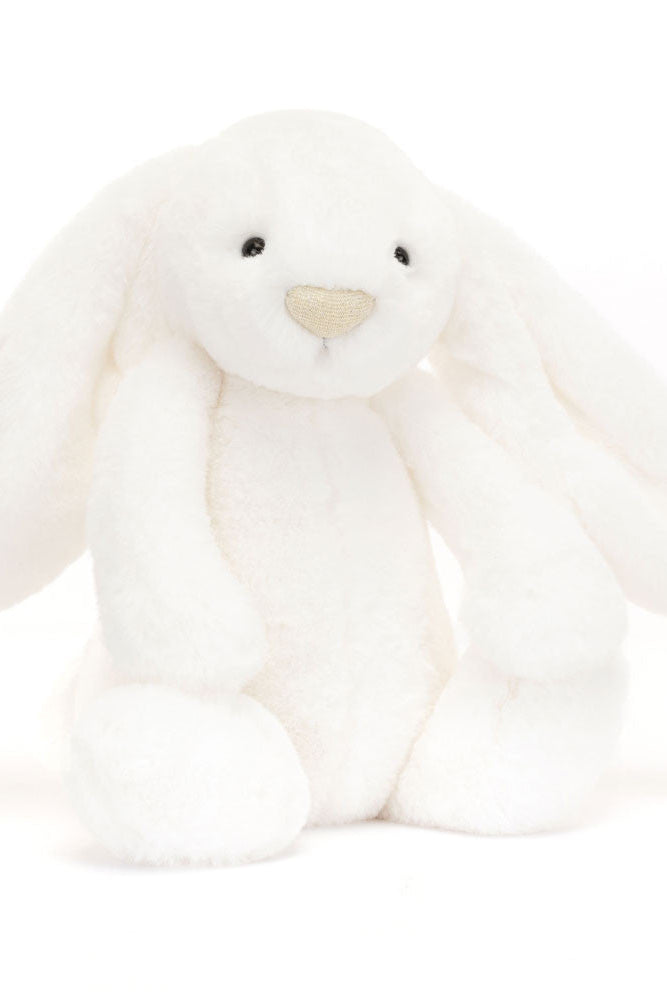 White plush bunny toy on a white background