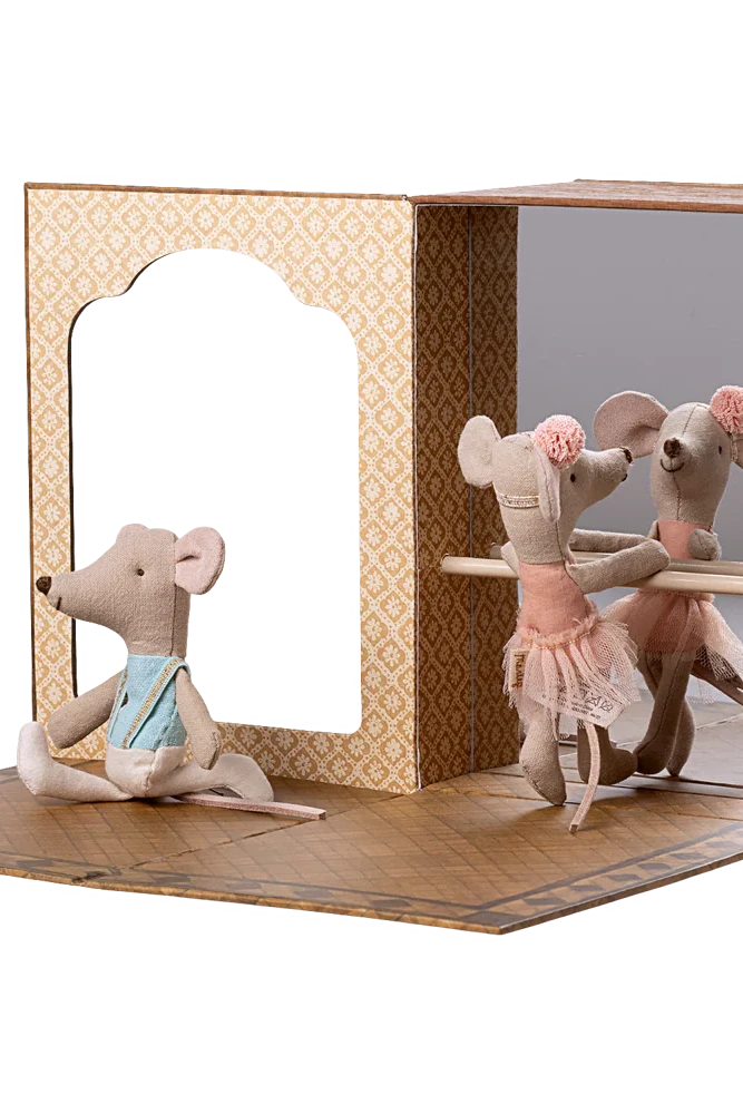 Toy mouse figures in a display case with a white background
