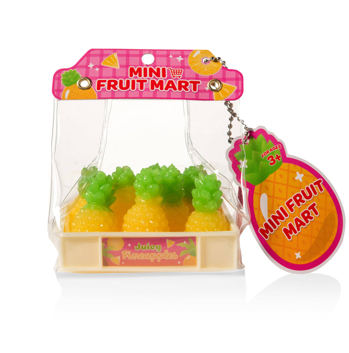 Packaged toy pineapples with 'Mini Fruit Mart' branding on a white background