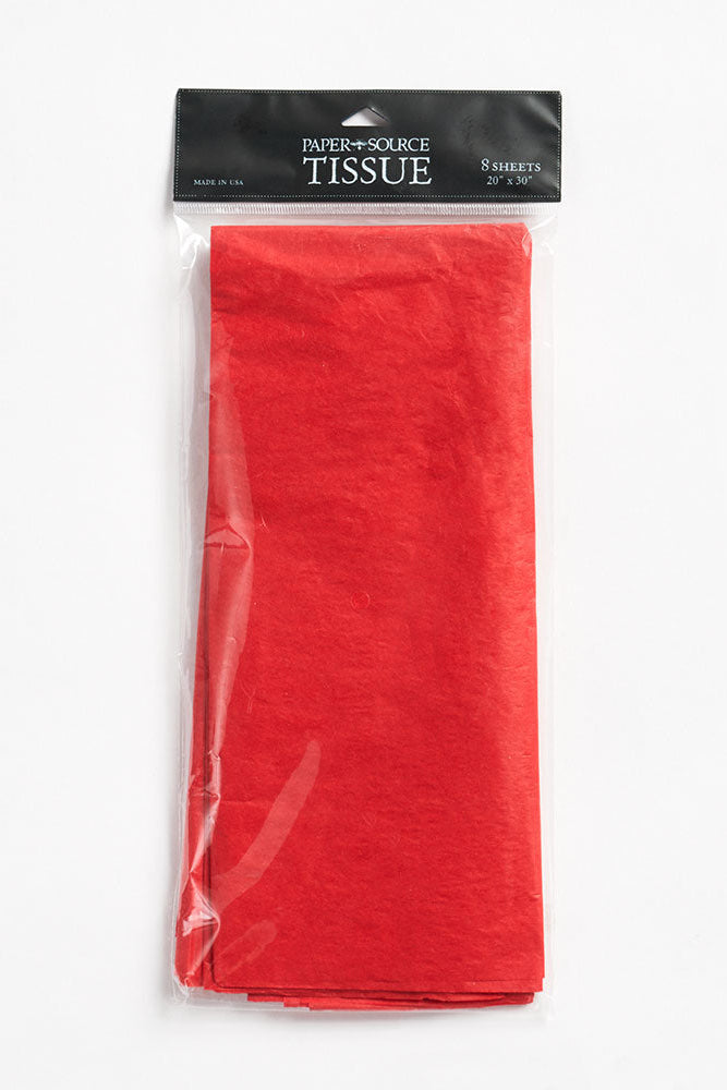 Pack of red tissue paper with a clear plastic wrap on a white background