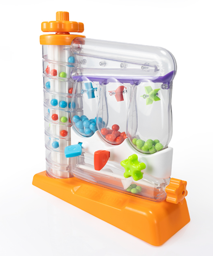 Colorful marble run toy with transparent sections on a white background