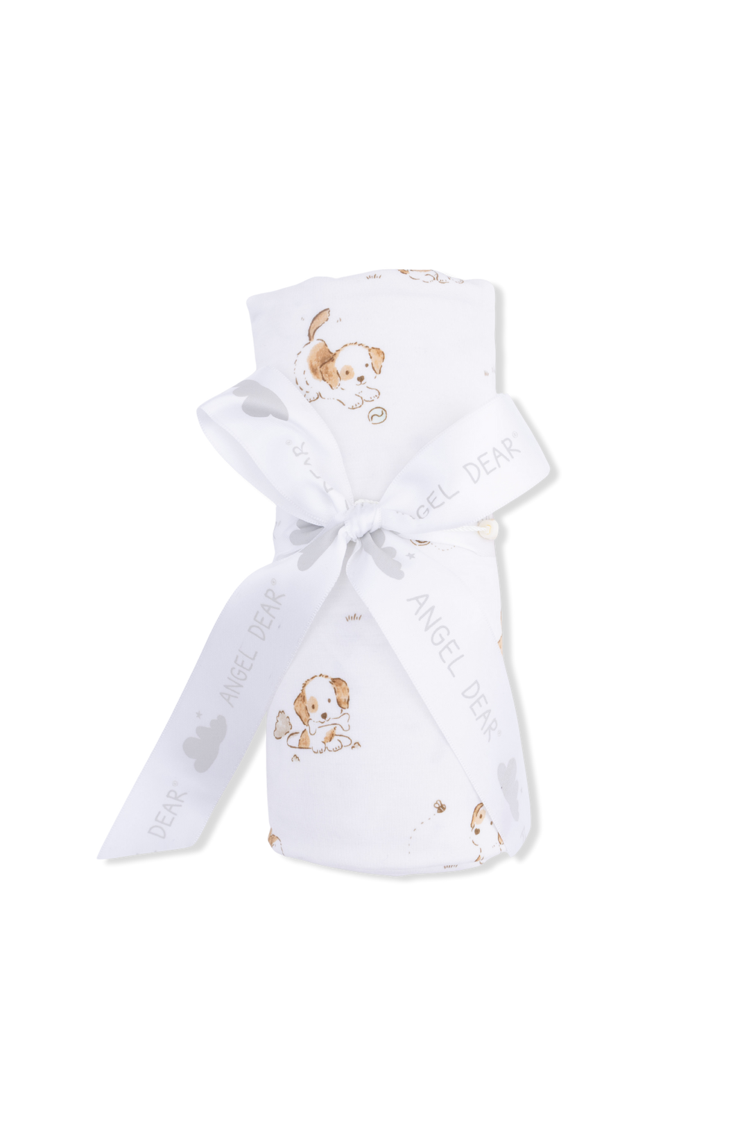 Puppies on white blanket rolled with ribbon tied 